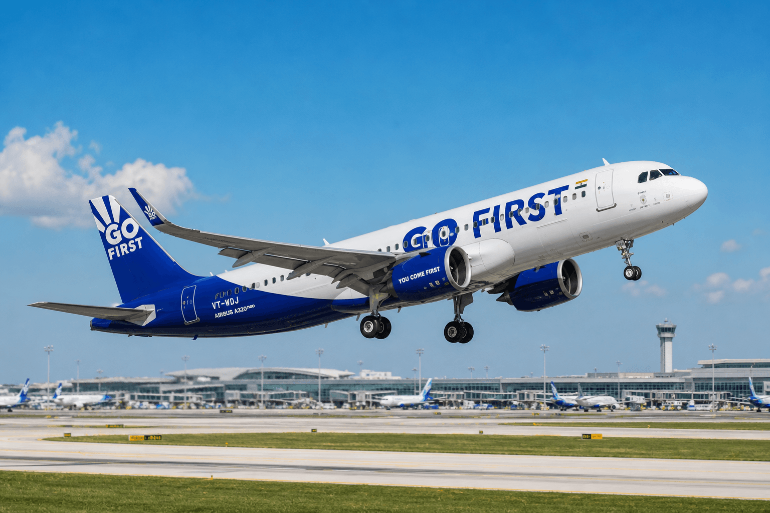 Go First aircraft taking off from an airport runway